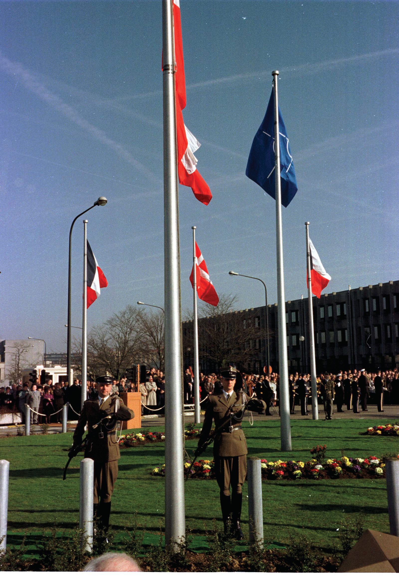 The Polish flag raised at NATO, March 1999. Canada had been the first allied country to ratify, fourteen months earlier.