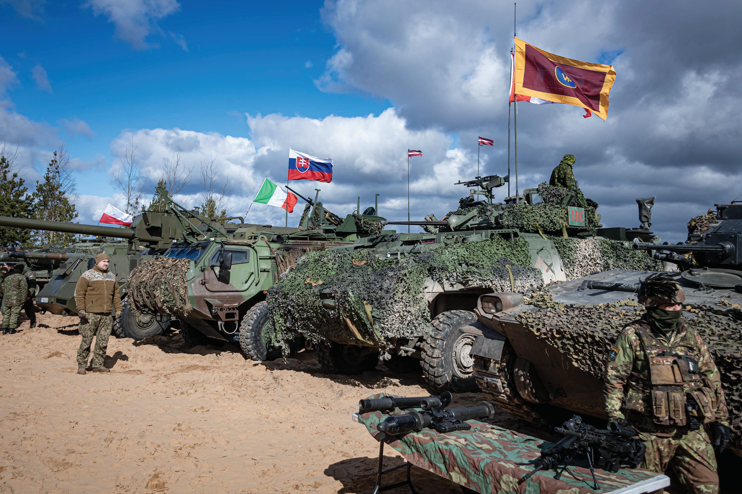 Members of multiple nations conduct a firepower demonstration for media and special guests during Operation REASSURANCE at Camp Adazi, Latvia on March 29, 2023.